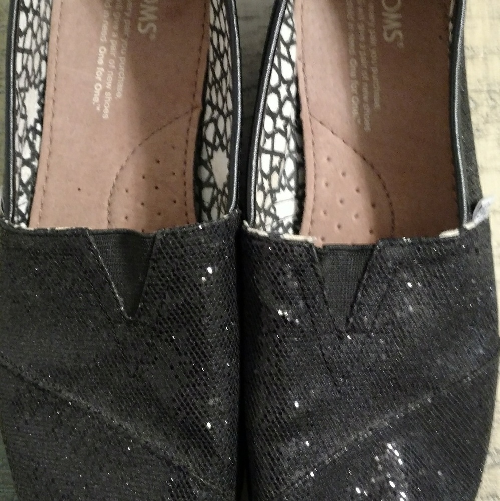 Tom's black glitter slip on